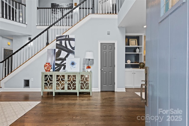 224 Wendover Heights Cir, Charlotte, NC 28211 - entrance foyer featuring a high ceiling, stairs, wood finished floors, and baseboards