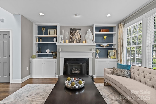 224 Wendover Heights Cir, Charlotte, NC 28211 - living area with wood finished floors, a fireplace, recessed lighting, baseboards, and built in features