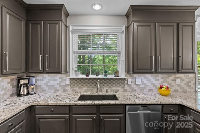 224 Wendover Heights Cir, Charlotte, NC 28211 - kitchen featuring dishwasher, a sink, tasteful backsplash, and light stone counters