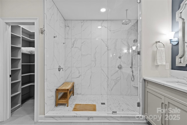 224 Wendover Heights Cir, Charlotte, NC 28211 - bathroom featuring a marble finish shower, vanity, and a walk in closet