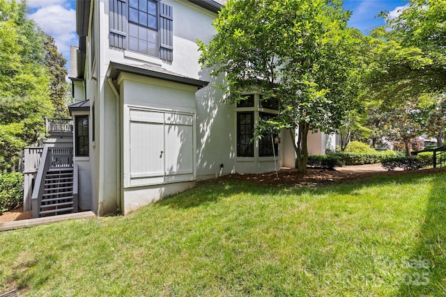 224 Wendover Heights Cir, Charlotte, NC 28211 - back of house with stucco siding, a lawn, and stairway
