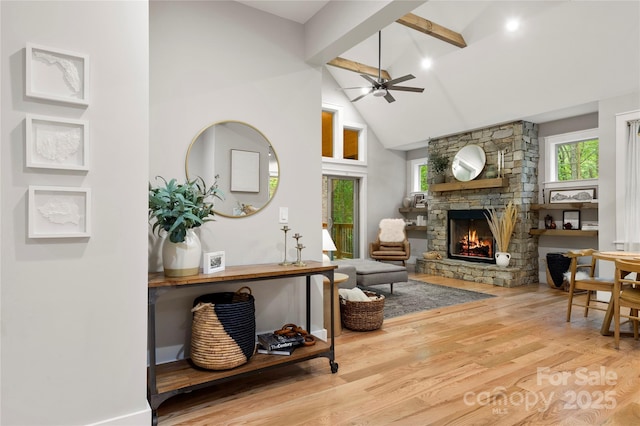 68 Huckleberry Ridge Ln, Zirconia, NC 28790 - living area featuring a fireplace, ceiling fan, high vaulted ceiling, wood finished floors, and beam ceiling