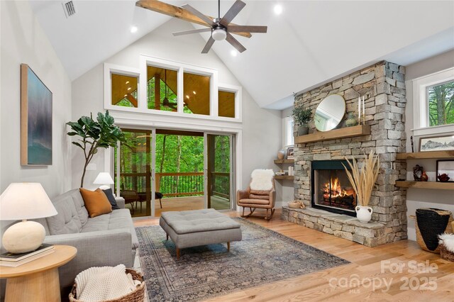 68 Huckleberry Ridge Ln, Zirconia, NC 28790 - living area with high vaulted ceiling, ceiling fan, a fireplace, and wood finished floors