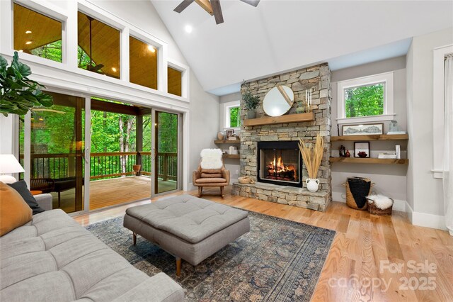 68 Huckleberry Ridge Ln, Zirconia, NC 28790 - living area featuring a ceiling fan, high vaulted ceiling, a fireplace, and wood finished floors