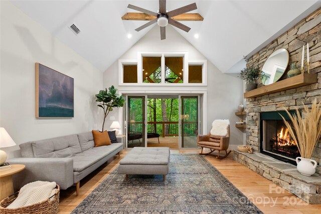 68 Huckleberry Ridge Ln, Zirconia, NC 28790 - living area featuring high vaulted ceiling, ceiling fan, wood finished floors, and a stone fireplace
