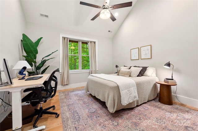 68 Huckleberry Ridge Ln, Zirconia, NC 28790 - bedroom featuring a desk, light wood-style floors, baseboards, a ceiling fan, and high vaulted ceiling
