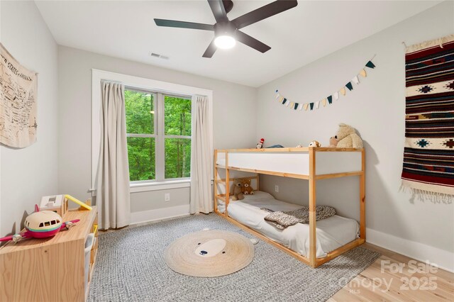 68 Huckleberry Ridge Ln, Zirconia, NC 28790 - bedroom featuring baseboards, wood finished floors, and a ceiling fan