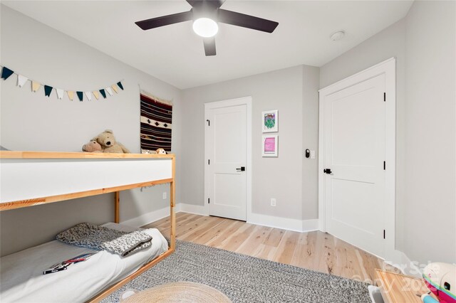 68 Huckleberry Ridge Ln, Zirconia, NC 28790 - bedroom with light wood finished floors, baseboards, and ceiling fan