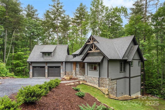 68 Huckleberry Ridge Ln, Zirconia, NC 28790 - craftsman inspired home featuring an attached garage, driveway, stone siding, and a shingled roof