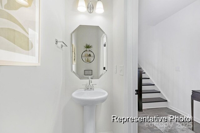 11335 Magpie Ct Unit 8, Charlotte, NC 28215 - bathroom with baseboards and wood finished floors