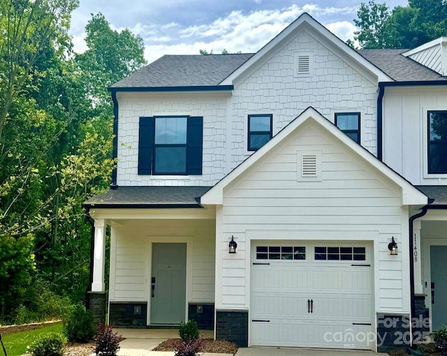 11335 Magpie Ct Unit 8, Charlotte, NC 28215 - view of front of property with a shingled roof, stone siding, and driveway