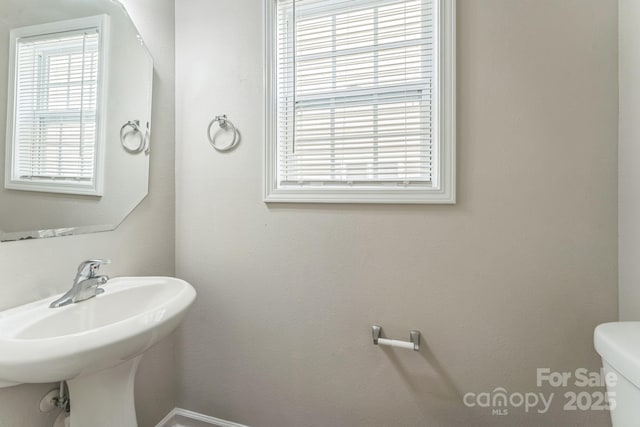 13413 Golden Apple Ct, Charlotte, NC 28215 - half bathroom with healthy amount of natural light and toilet