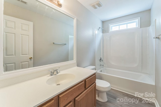 13413 Golden Apple Ct, Charlotte, NC 28215 - full bathroom featuring toilet, vanity, shower / tub combination, and wood finished floors