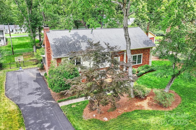 7050 Knightswood Dr, Charlotte, NC 28226 - view of front of house featuring brick siding, a chimney, and roof with shingles