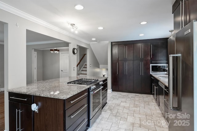 7050 Knightswood Dr, Charlotte, NC 28226 - kitchen featuring stainless steel appliances, crown molding, light stone counters, light stone finish floors, and recessed lighting