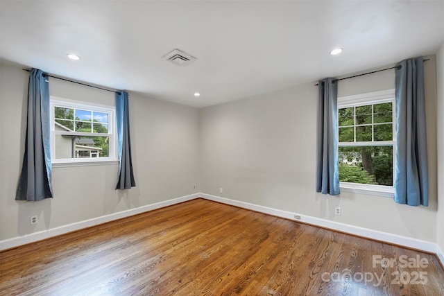 7050 Knightswood Dr, Charlotte, NC 28226 - spare room with wood finished floors and recessed lighting