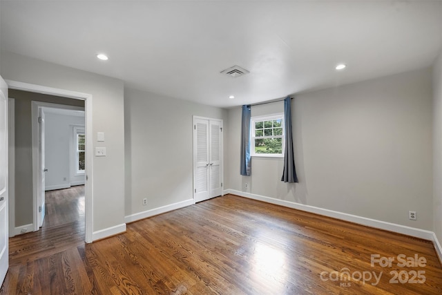 7050 Knightswood Dr, Charlotte, NC 28226 - unfurnished bedroom featuring wood finished floors, a closet, and recessed lighting