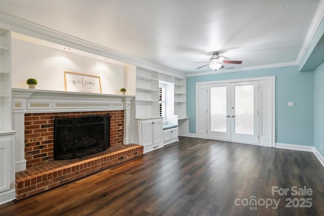 7050 Knightswood Dr, Charlotte, NC 28226 - unfurnished living room with ceiling fan, dark wood-style floors, french doors, ornamental molding, and a fireplace