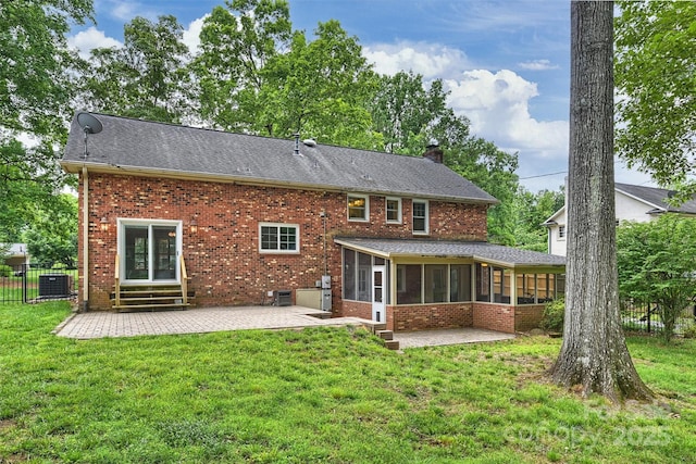 7050 Knightswood Dr, Charlotte, NC 28226 - rear view of house with a sunroom, a patio, entry steps, a chimney, and brick siding