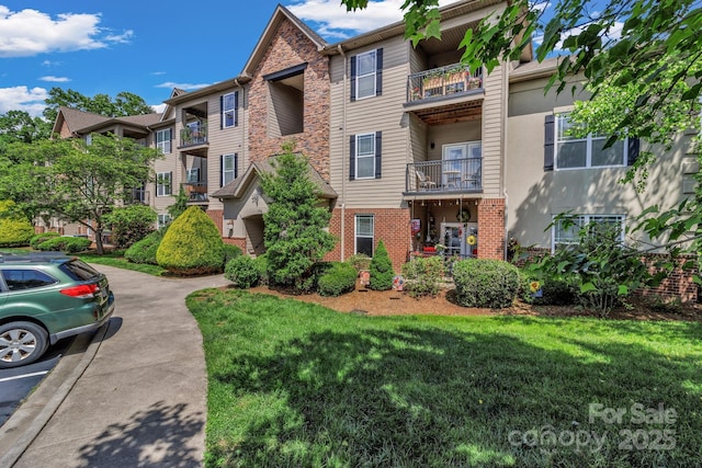 176 Brickton Village Cir Unit 302, Fletcher, NC 28732 - view of apartment building / complex with uncovered parking