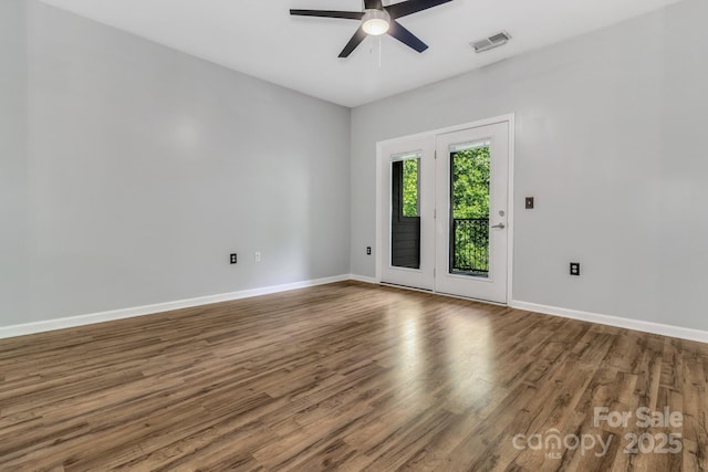 176 Brickton Village Cir Unit 302, Fletcher, NC 28732 - empty room featuring ceiling fan, wood finished floors, and baseboards