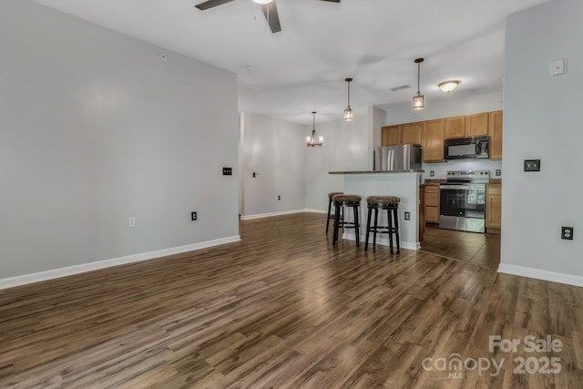 176 Brickton Village Cir Unit 302, Fletcher, NC 28732 - kitchen with appliances with stainless steel finishes, a ceiling fan, dark wood-type flooring, baseboards, and a chandelier