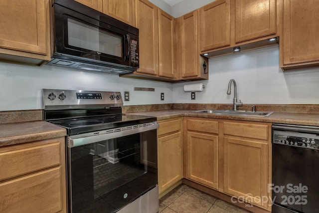 176 Brickton Village Cir Unit 302, Fletcher, NC 28732 - kitchen featuring black appliances, a sink, light tile patterned floors, and dark countertops