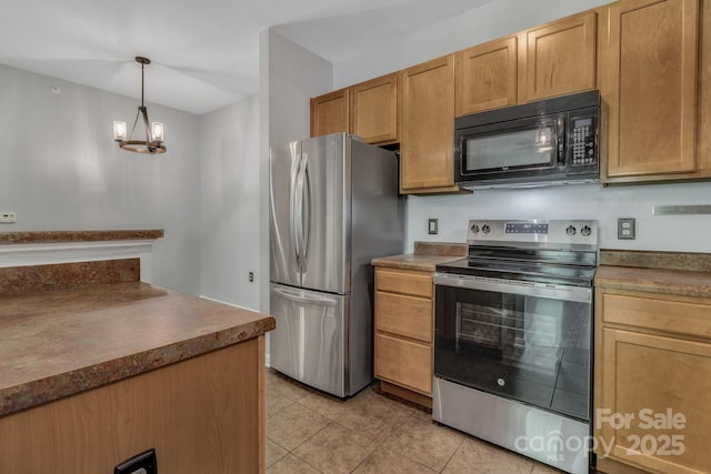 176 Brickton Village Cir Unit 302, Fletcher, NC 28732 - kitchen featuring stainless steel appliances, light tile patterned floors, dark countertops, pendant lighting, and a chandelier
