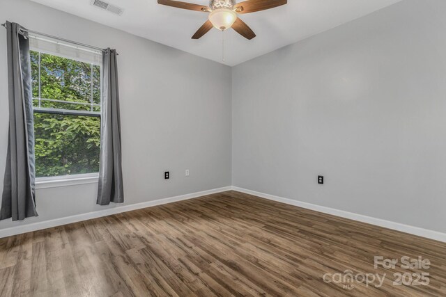 176 Brickton Village Cir Unit 302, Fletcher, NC 28732 - unfurnished room featuring wood finished floors, baseboards, and a ceiling fan