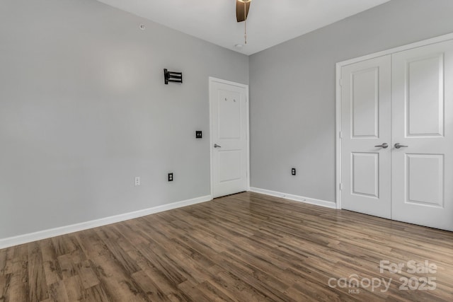 176 Brickton Village Cir Unit 302, Fletcher, NC 28732 - unfurnished bedroom featuring wood finished floors, baseboards, a closet, and ceiling fan
