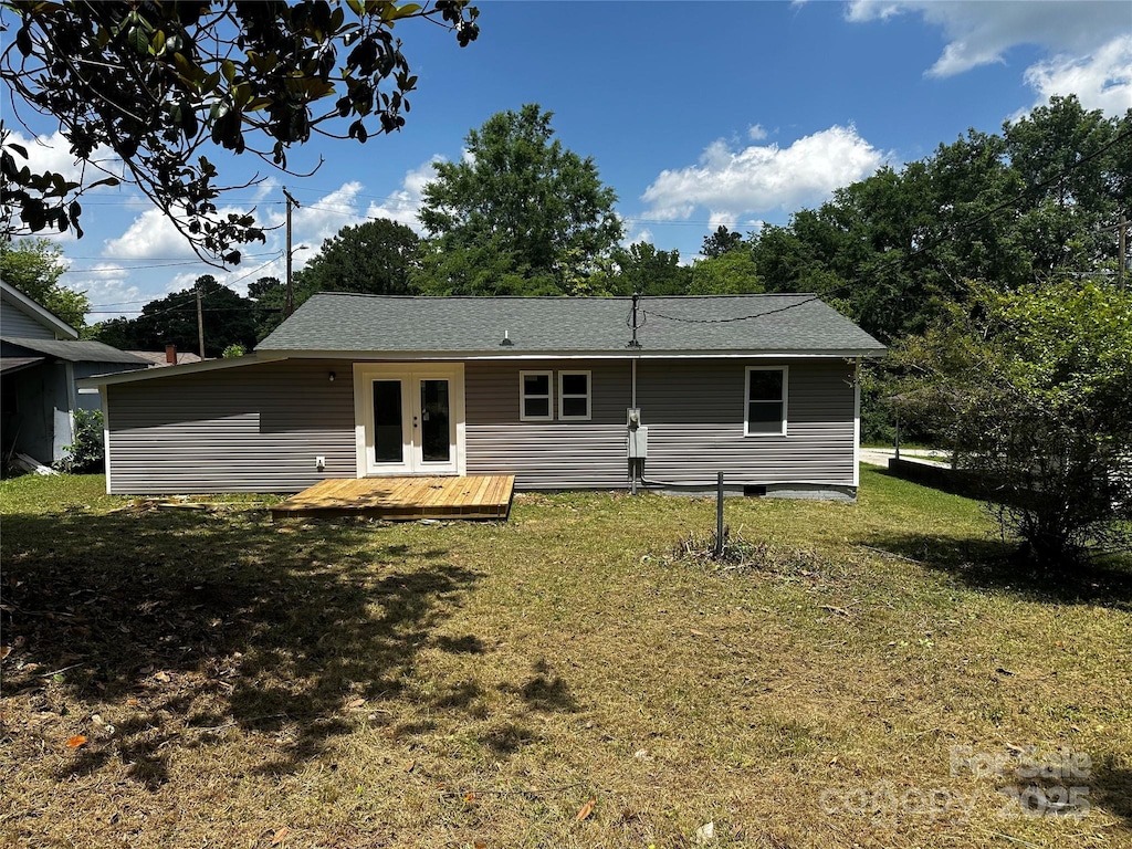 801 Calhoun St, Lancaster, SC 29720 - back of property with french doors, a yard, a deck, and roof with shingles