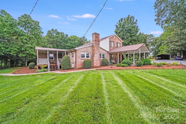 211 Drive Inn Rd, Locust, NC 28097 - back of property featuring a porch, a yard, a chimney, and metal roof