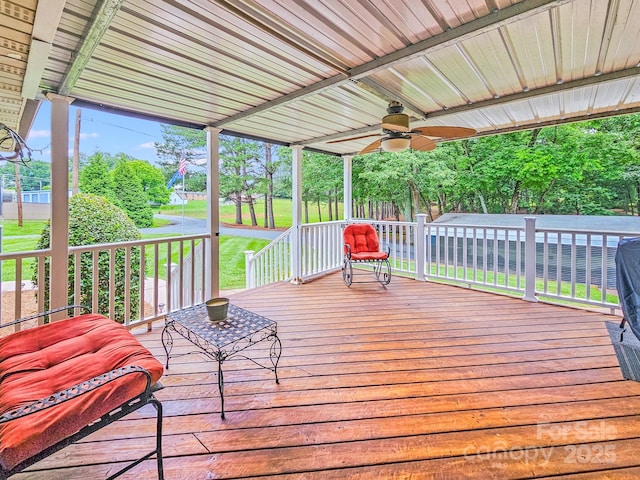 211 Drive Inn Rd, Locust, NC 28097 - porch featuring a ceiling fan and a lawn