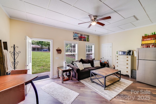 211 Drive Inn Rd, Locust, NC 28097 - living room featuring a ceiling fan, wood finished floors, and a drop ceiling