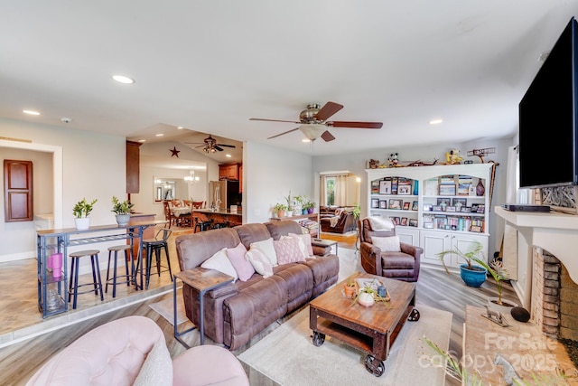 211 Drive Inn Rd, Locust, NC 28097 - living area with light wood-style floors, ceiling fan, recessed lighting, and a fireplace
