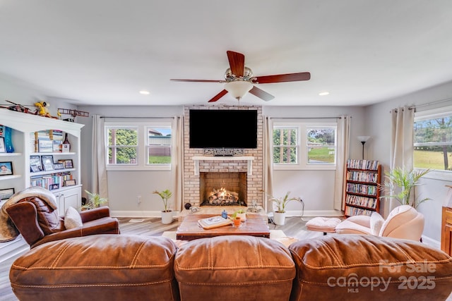211 Drive Inn Rd, Locust, NC 28097 - living room with baseboards, a fireplace, plenty of natural light, and recessed lighting