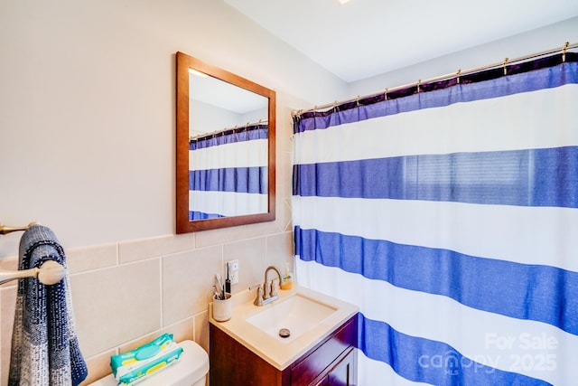 211 Drive Inn Rd, Locust, NC 28097 - bathroom with vanity, tile walls, toilet, and a shower with curtain