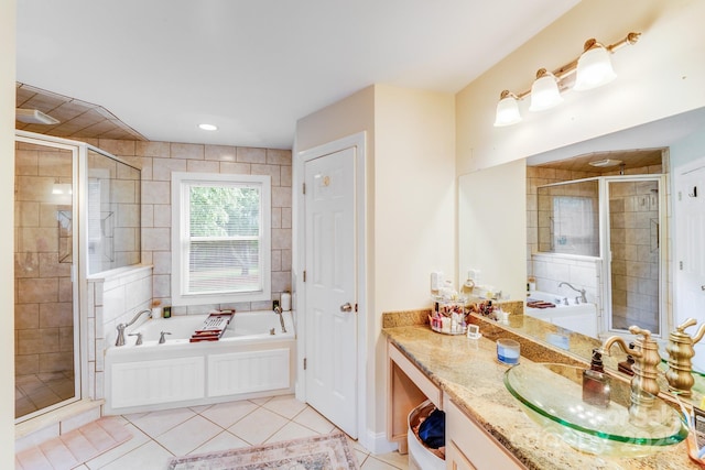 211 Drive Inn Rd, Locust, NC 28097 - bathroom with tile patterned flooring, vanity, a garden tub, and a shower stall