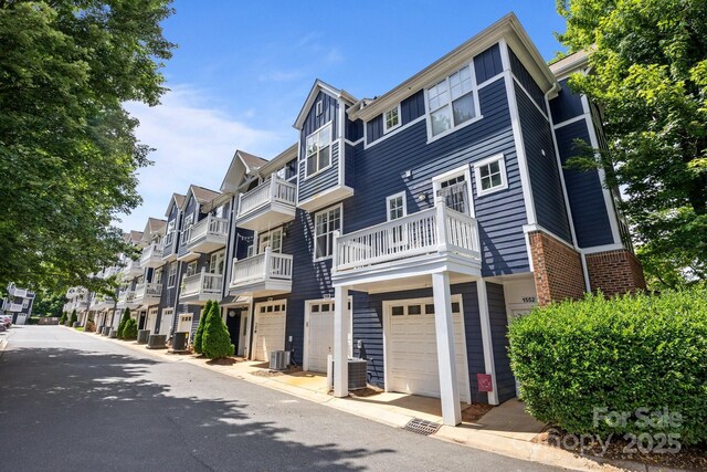 1556 Walnut View Dr, Charlotte, NC 28208 - view of building exterior with a garage and a residential view