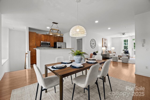 1556 Walnut View Dr, Charlotte, NC 28208 - dining room featuring light wood-style floors, recessed lighting, and a ceiling fan