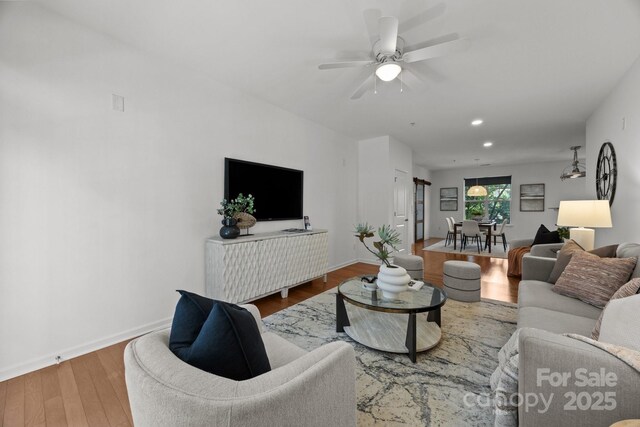 1556 Walnut View Dr, Charlotte, NC 28208 - living room with wood finished floors, a ceiling fan, and recessed lighting