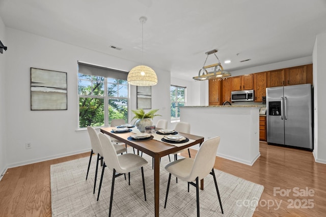 1556 Walnut View Dr, Charlotte, NC 28208 - dining space with light wood-type flooring and baseboards