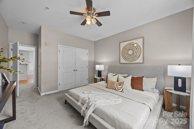1556 Walnut View Dr, Charlotte, NC 28208 - bedroom featuring light carpet, a closet, and a ceiling fan