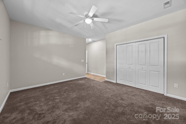 1556 Walnut View Dr, Charlotte, NC 28208 - unfurnished bedroom featuring carpet, a closet, and ceiling fan