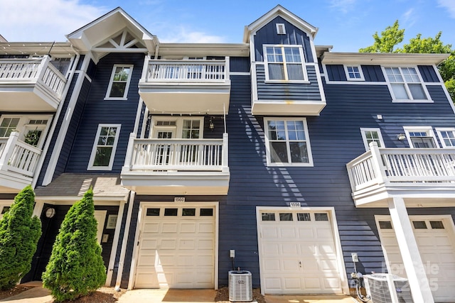 1556 Walnut View Dr, Charlotte, NC 28208 - view of front of home featuring a balcony, a garage, and driveway