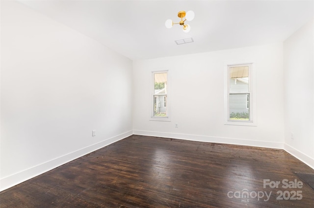 1112 Concord Ave, Monroe, NC 28110 - unfurnished room featuring baseboards and dark wood finished floors