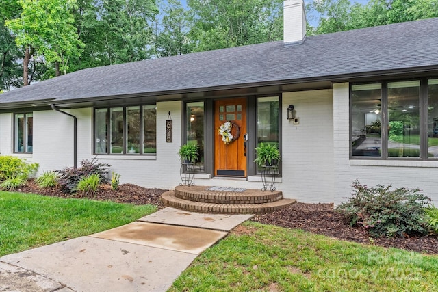625 S Magnolia St, Mooresville, NC 28115 - view of front of property featuring brick siding, a shingled roof, and a chimney