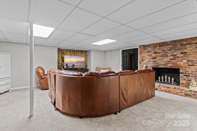 625 S Magnolia St, Mooresville, NC 28115 - living area featuring carpet floors, a fireplace, and a paneled ceiling