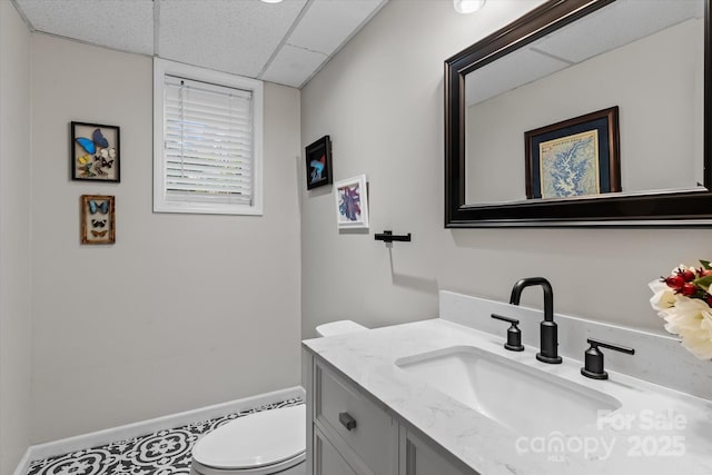 625 S Magnolia St, Mooresville, NC 28115 - half bathroom featuring vanity, a drop ceiling, and toilet