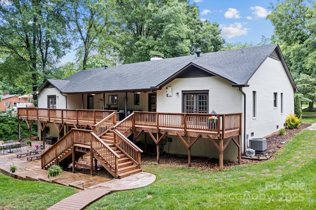 625 S Magnolia St, Mooresville, NC 28115 - back of house with a shingled roof, brick siding, a yard, a patio, and a wooden deck